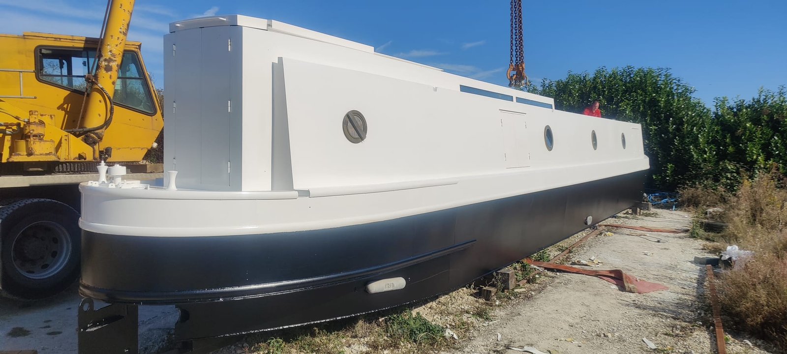 Narrowboat freshly sprayed in crisp white and deep black