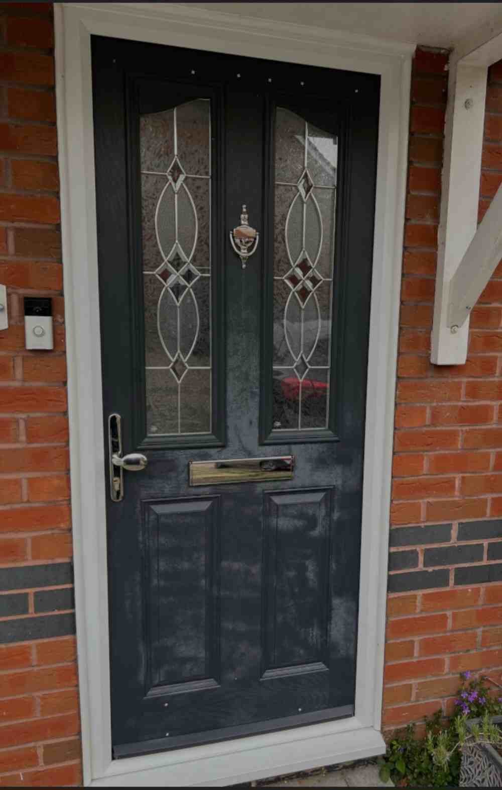 Tired, faded dark front door before respraying
