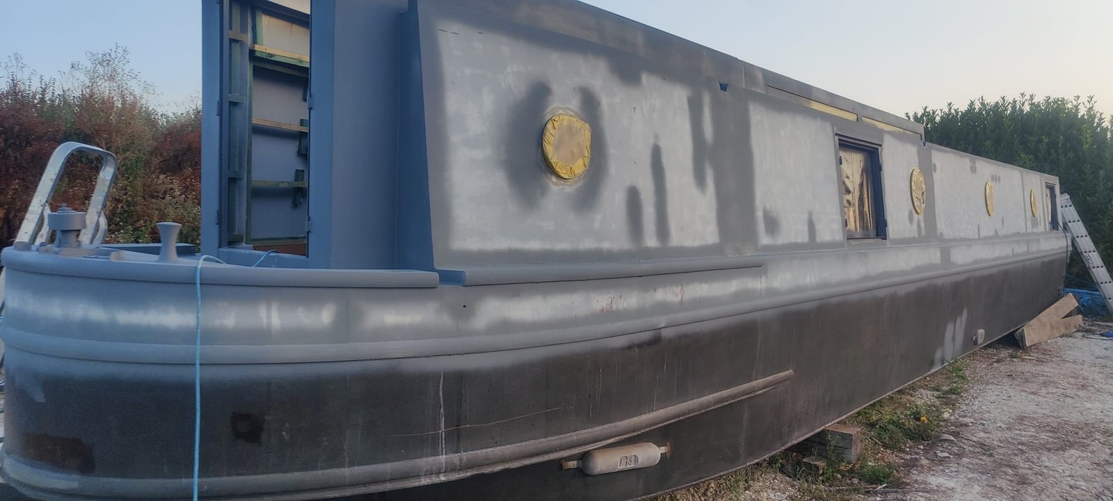 Narrowboat sanded and in primer ready for its topcoat