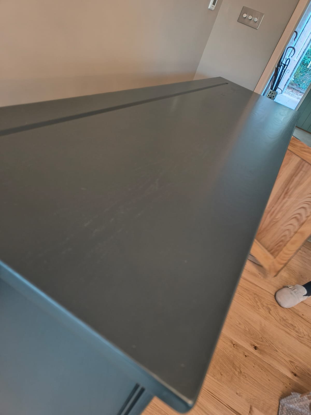 Solid wood cabinet sprayed in a deep, even grey factory finish